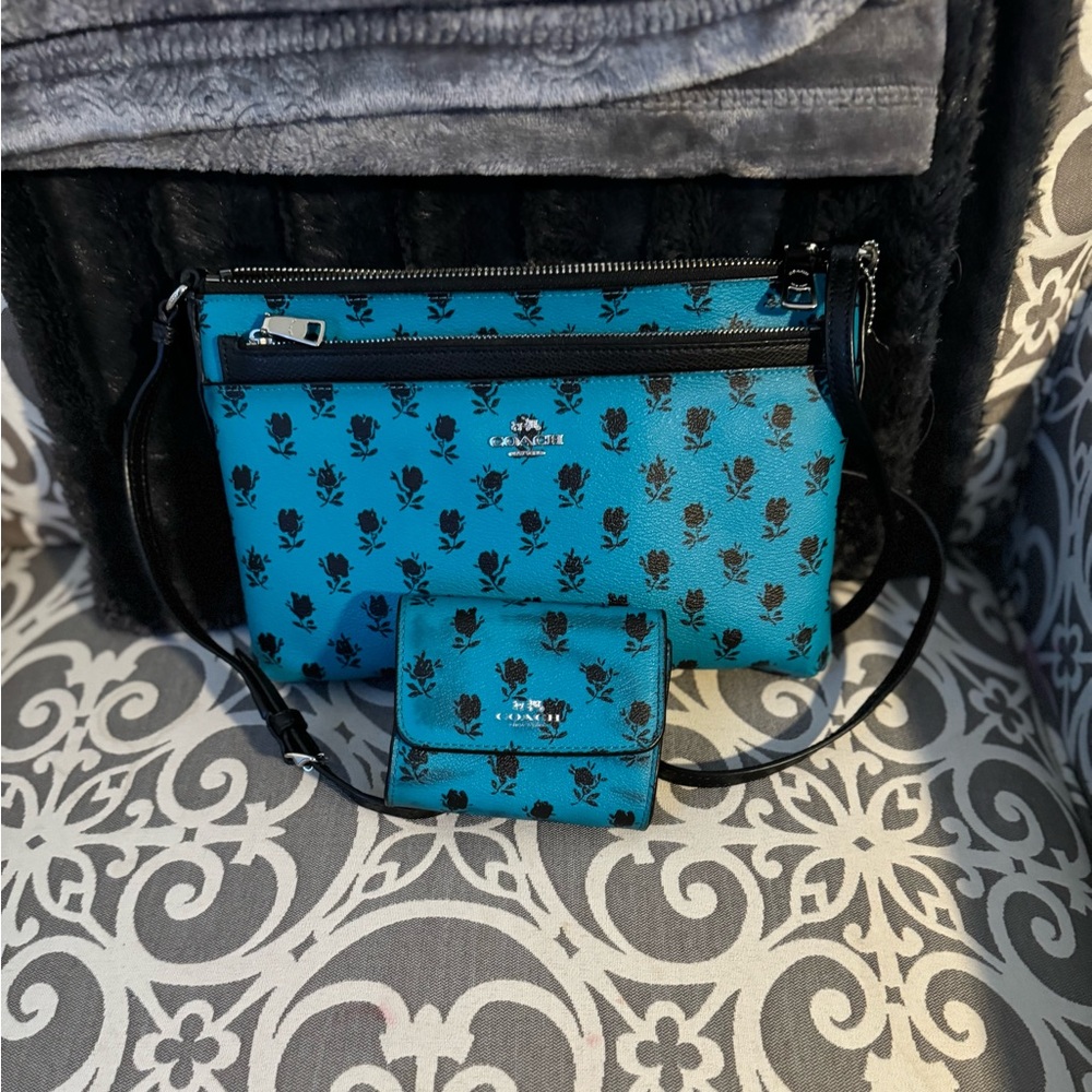 Coach crossbody with matching wallet.